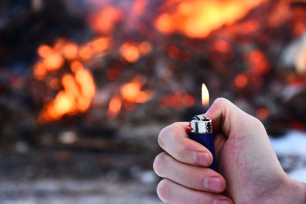 A person using a lighter