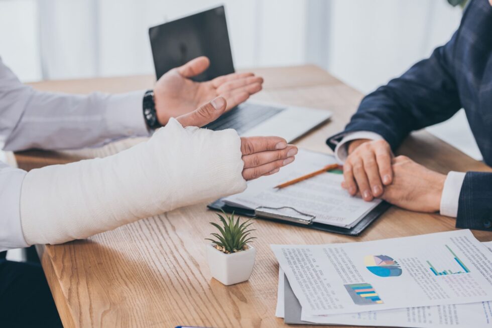 Injured person discussing with a lawyer